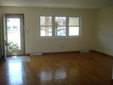 Living Room with hardwood floor open to dining roo