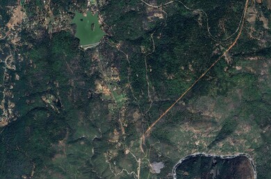 Overhead photo of property and greater surrounding