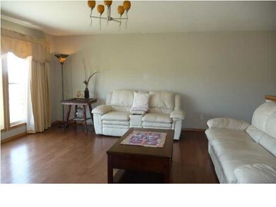 The home features marble entry and oak flooring on