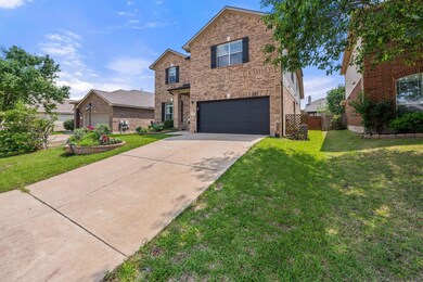 Traditional-style home with fence, an attached ga