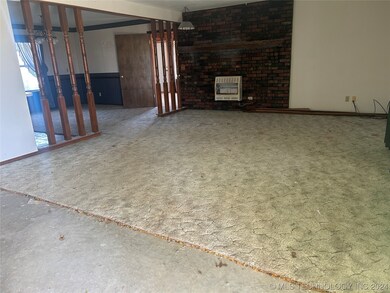 Living room, carpet removed due to AC leak which h