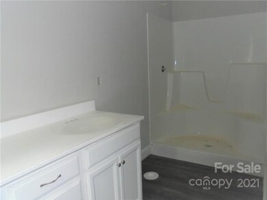 Primary bath with large shower and LVT flooring Du