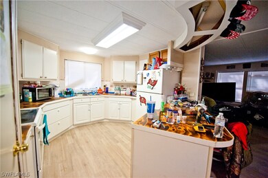 Lots of cabinets & breakfast bar