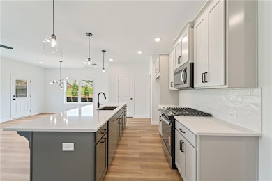 Everyone loves an open kitchen. The island is over 9 feet long! Plenty of seating and gathering with friends!