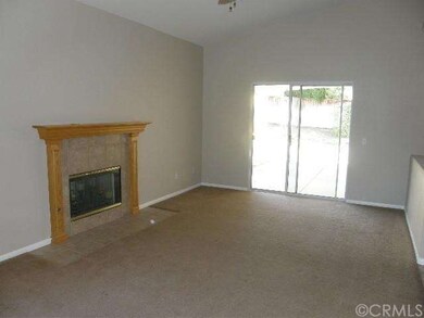 Family Room with fireplace and sliding door to rea