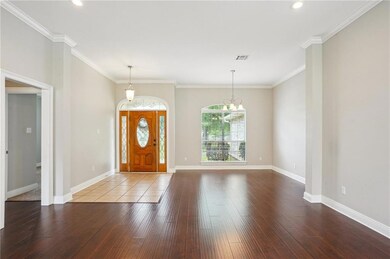 Beautiful front door, 10' ceilings & tons of natur