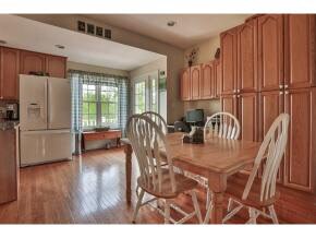 Wonderful eat-in kitchen surrounded by cabinets an