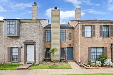 This charming brick-front townhome offers a clean,