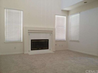 Formal Living room has a fireplace, soaring ceilin