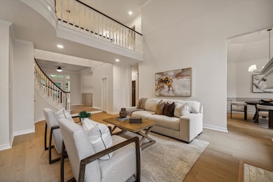 THE FAMILY ROOM ALSO FEATURES VIEWS OF THE DINING
