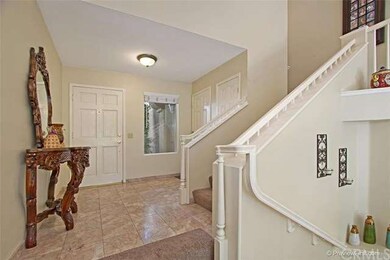 Looking back at the foyer & front door, flooring i