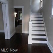 newly refinished stairs in front foyer. Light and bright area!