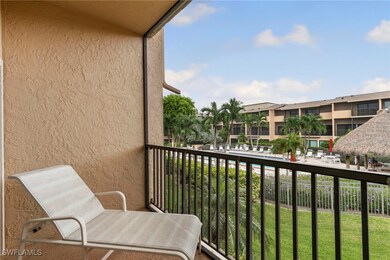 Living room has a view of the pool area