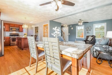 Open concept living, dining and kitchen areas.