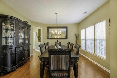 The formal dining room has plenty of space for your large family gatherings.
