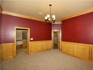 Large master bedroom with upgraded wood panels.