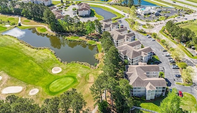 Drone / aerial view featuring golf course view, a 