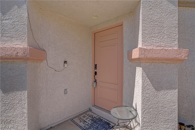 Doorway to property with stucco siding
