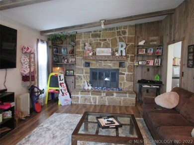Living room has beautiful laminate wood look floor