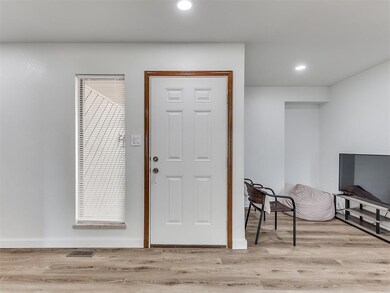 Foyer entrance with light hardwood / wood-style fl