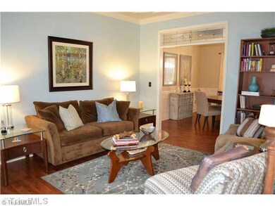 Living Room. The formal living room is gorgeous!  Notice the detailed ceiling molding and transom over the entry to the dining room!