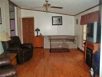 Living room that is hight lighted by a gas firepla