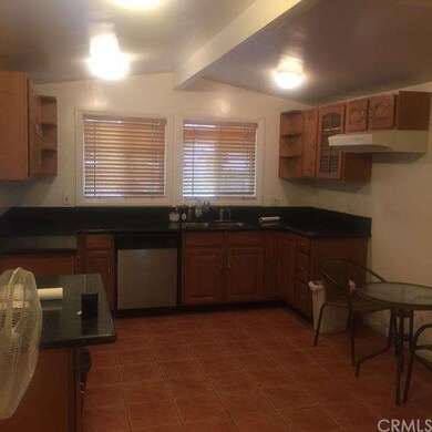 Granite counter tops with newer kitchen cabinets. Stainless Steel Dishwasher.