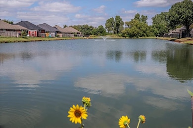 Water view featuring nearby suburban area