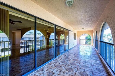 Corridor with a textured ceiling and a textured wa