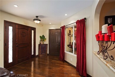 Front door entrance with access door to garage.