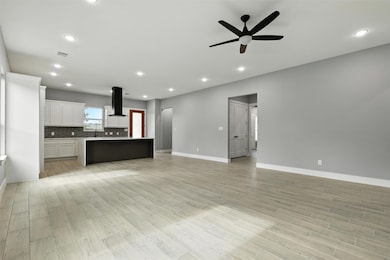 This open-concept living space features light floo