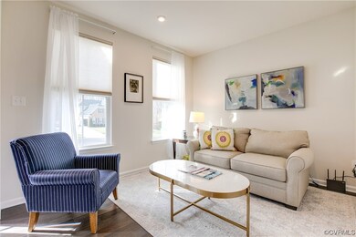 Living room with light hardwood / wood-style floor