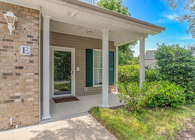View of exterior entry featuring covered porch