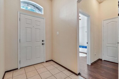 Entryway to a bedroom with engineered hardwood flo