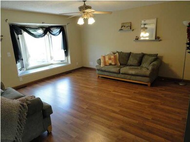 Large open living room with new wood laminate floo