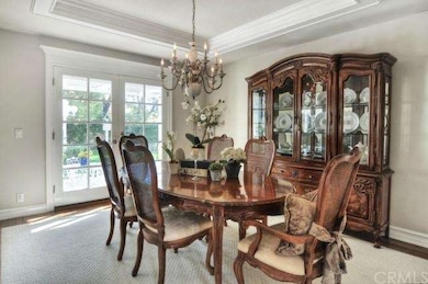 Formal dining with French doors leading to one of 