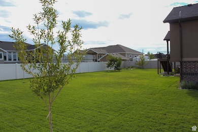 View of fenced backyard