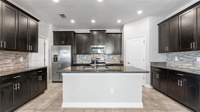 9881 Magnolia Woods Blvd, Orlando, FL 32832 - photo 6