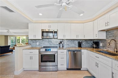 Kitchen featuring subway tile  backsplash, granite