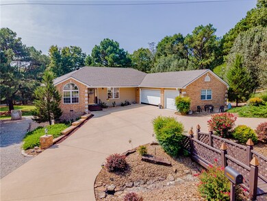 Circular driveway and 3 car side load garage.