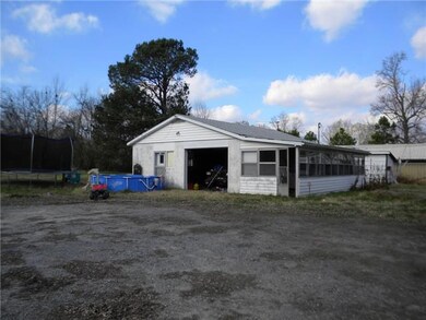 Large block building/garage behind house