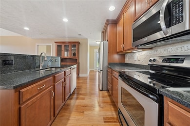 Gorgeous kitchen with stainless appliances, pantry