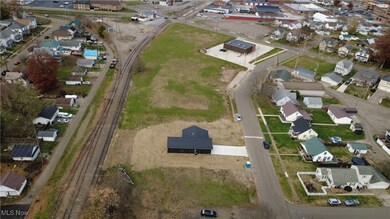 Aerial view of property's location with nearby suburban area
