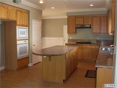 Kitchen as Center Island with Granite Counter tops