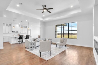 Living room with light wood finished floors, ceili