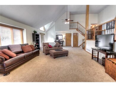 Open & Bright w/vaulted ceilings, newer carpeting,
