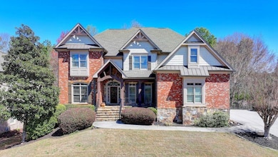 View of front of house with metal roof, a front ya