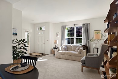 Spacious Living and dining rooms with new carpet and plenty of light