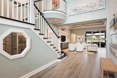 The handsome foyer with upgraded composite wood fl