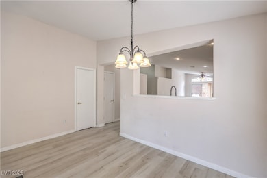 Unfurnished dining area with a chandelier, light w